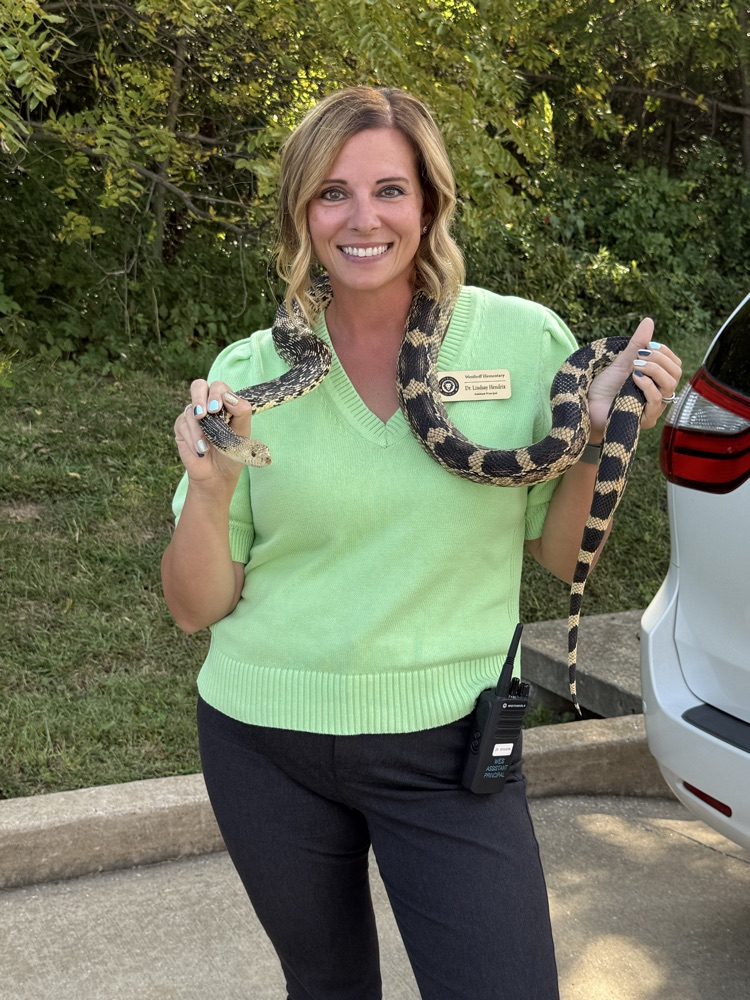 Dr. Hendrix braving a snake!