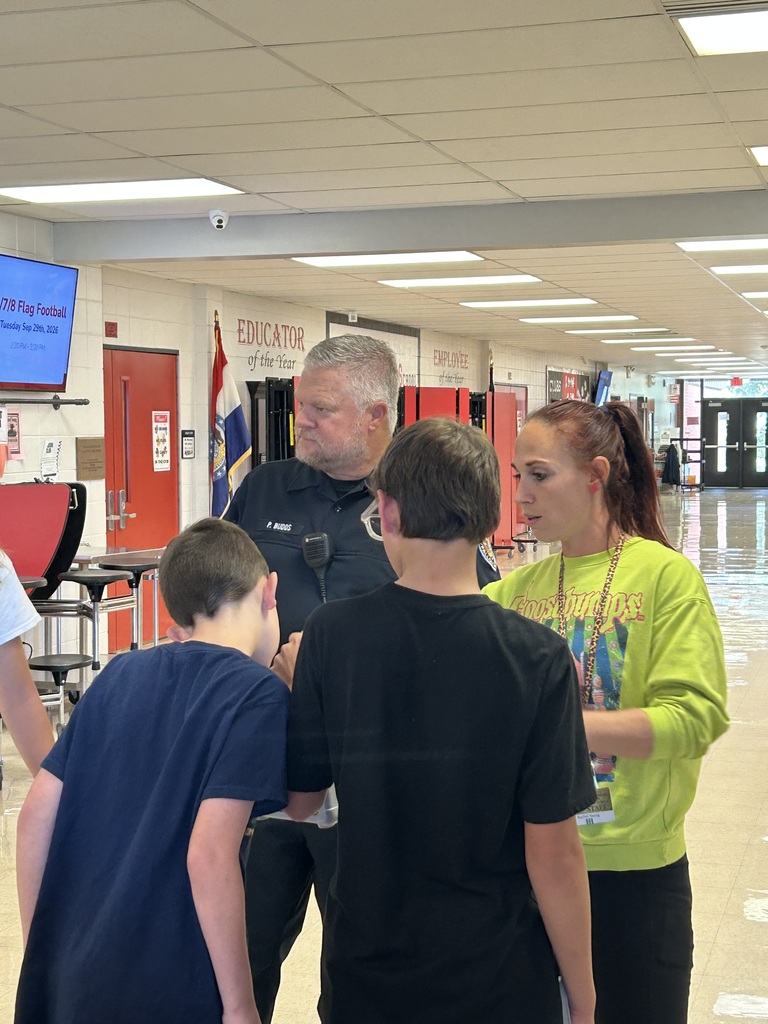 Officer Budds listening to the students share there excitement.