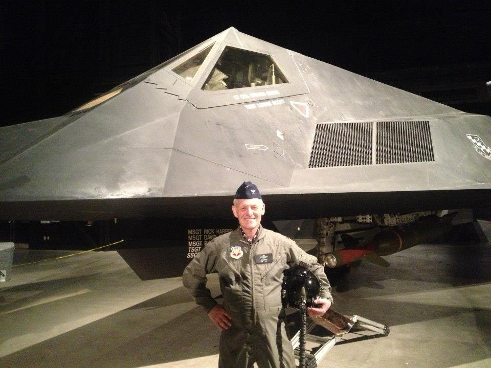 Brian Wilber standing in front of the stealth fighter first gen