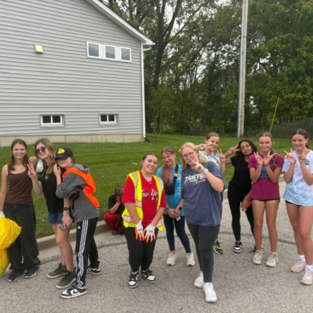 students cleaning creek after school