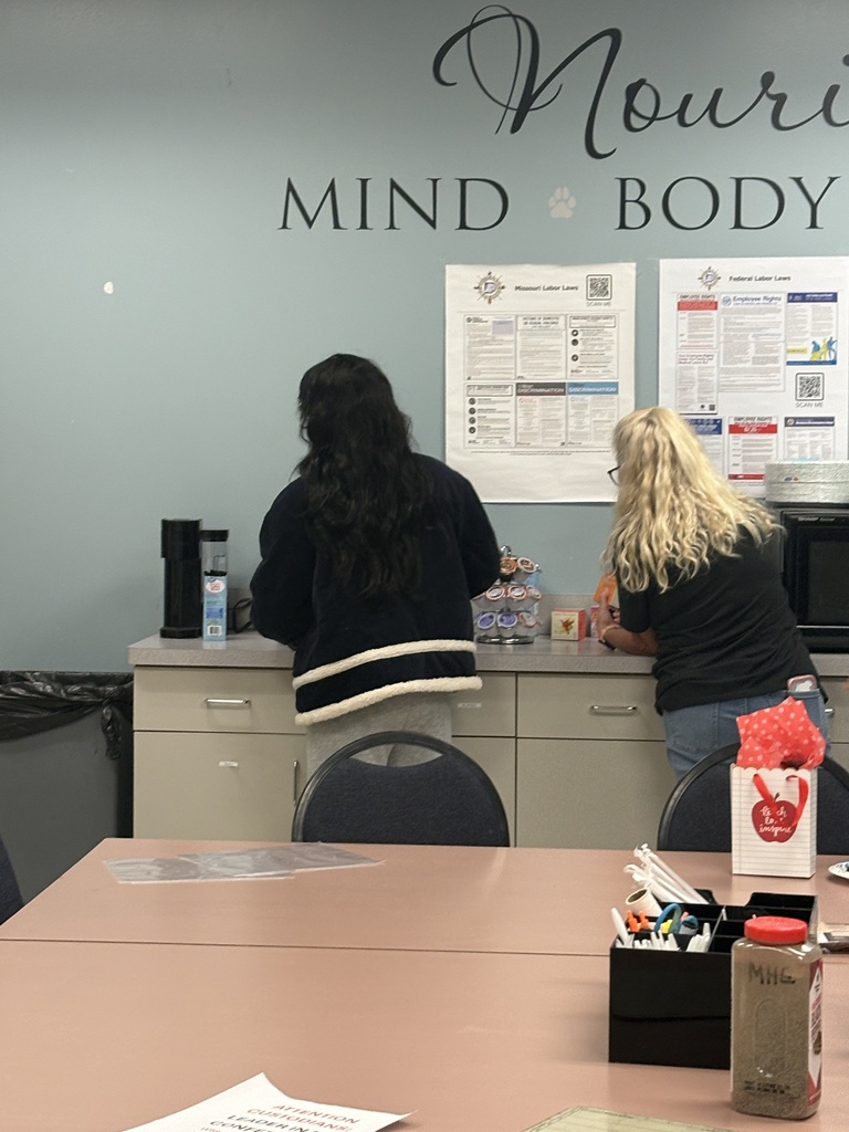Teachers searching for apples on Apple Day