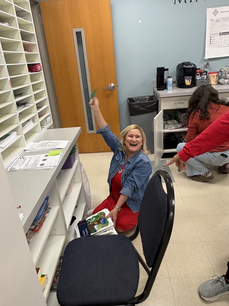 Teachers searching for apples on Apple Day