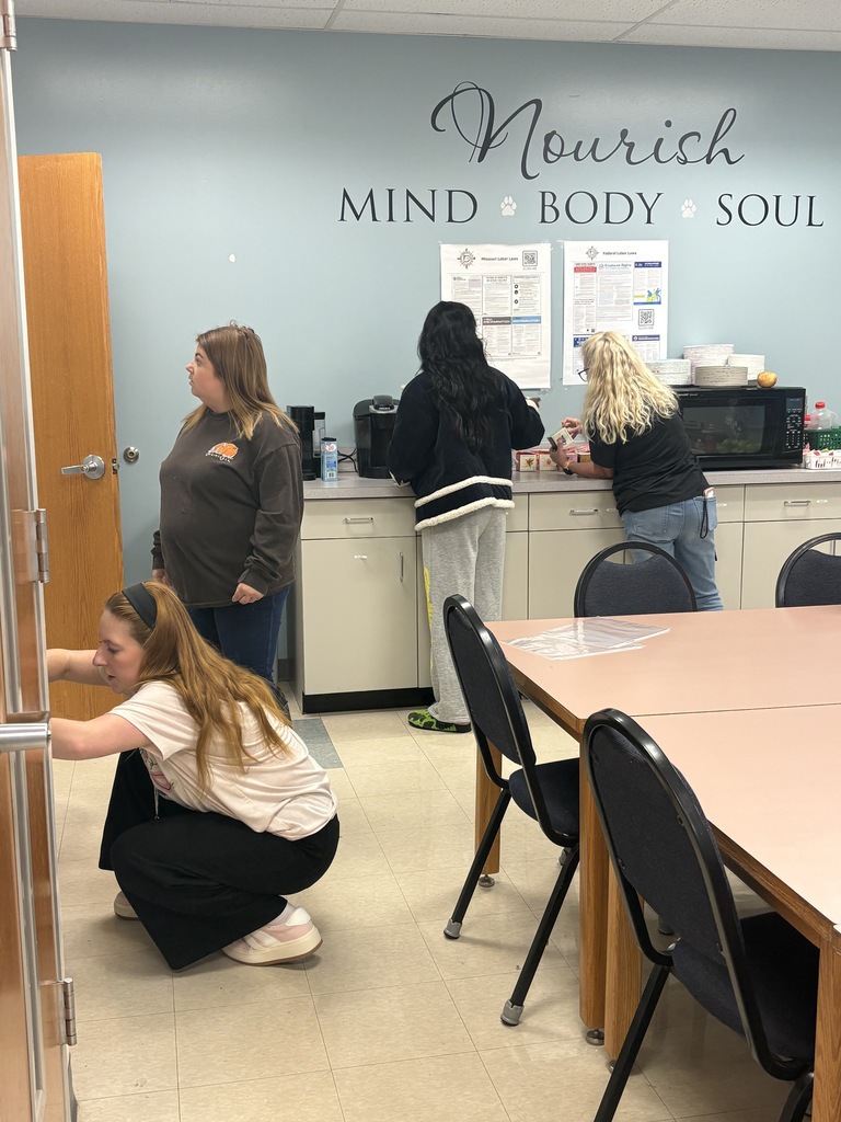 Teachers searching for apples on Apple Day