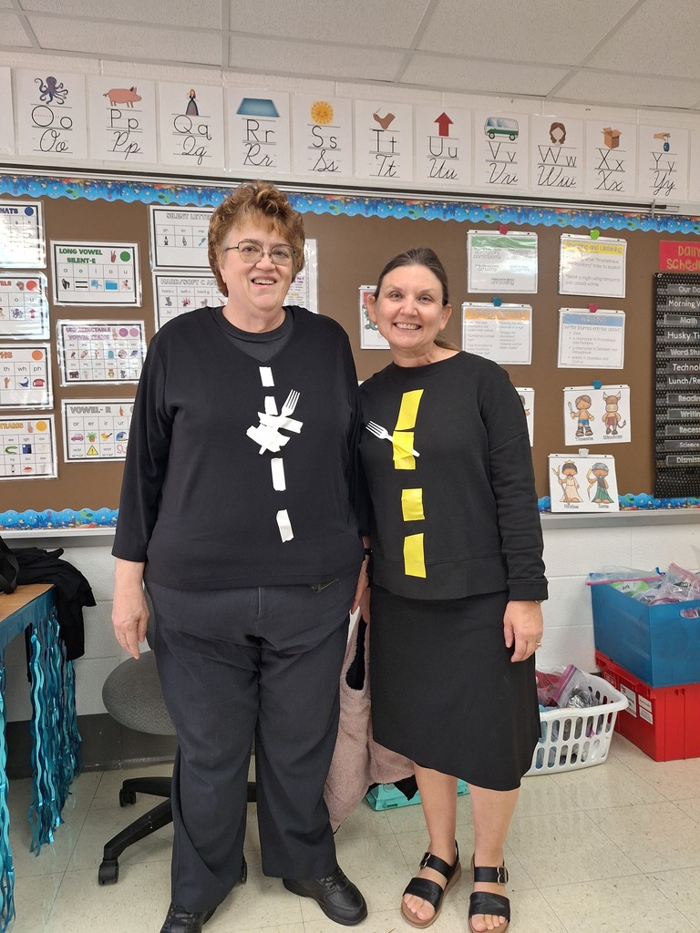 Two teachers dressed up as a fork in the road.