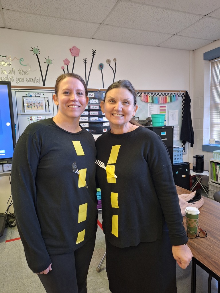 Two teachers dressed up as a fork in the road.