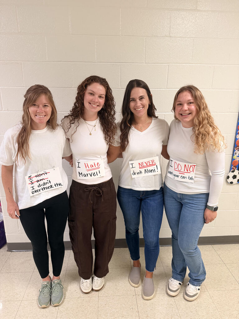 Four teachers dressed up as little white lies.