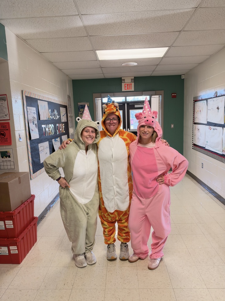 Teachers dressed up as animals with party hats on.