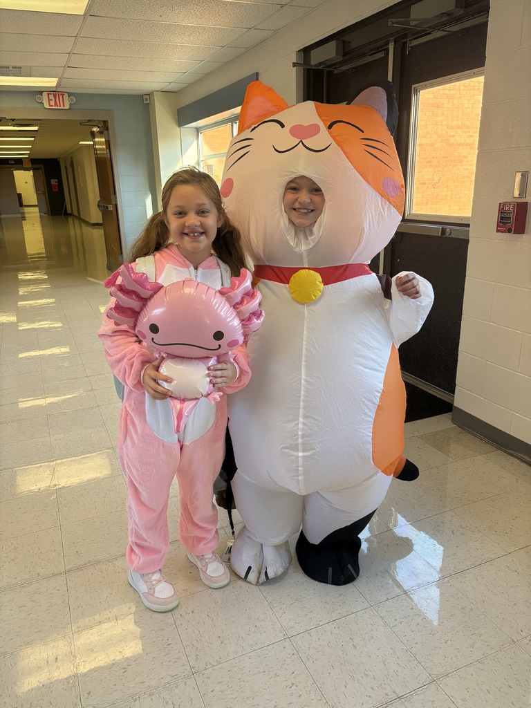 One girl dressed up as a white and orange cat and one girl dressed up as an axolotl.