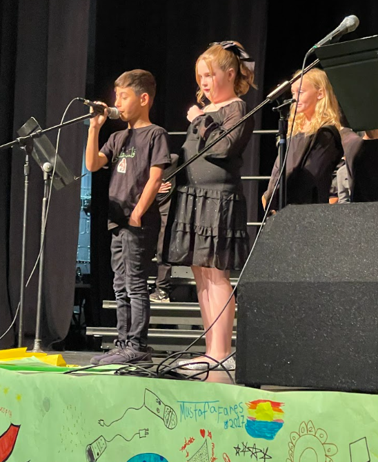 Students singing in their 4th grade musical.