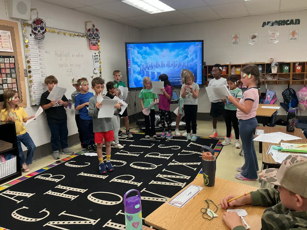 Students learning about Ancient Greece in a classroom.