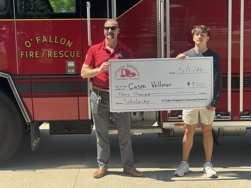 photo of student accepting scholarship