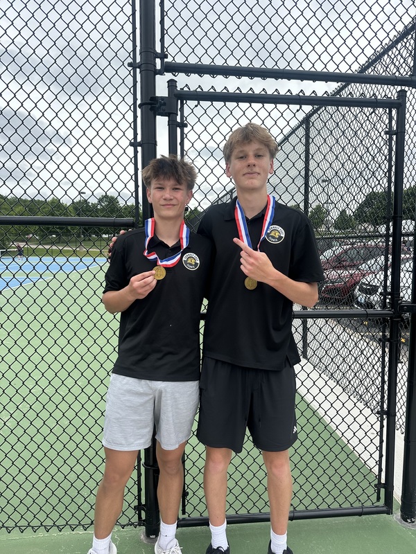 Friedman and Griewing posing with their gold medal