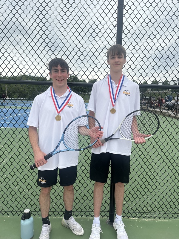 Klobe and Linneman posing with gold