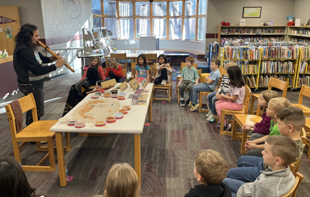 Dennis Rogers teaches about "Native American sand art" & flute  (at Fosston elementary school).