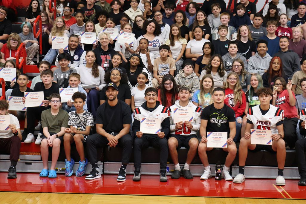 Close up of students with Micah Hyde