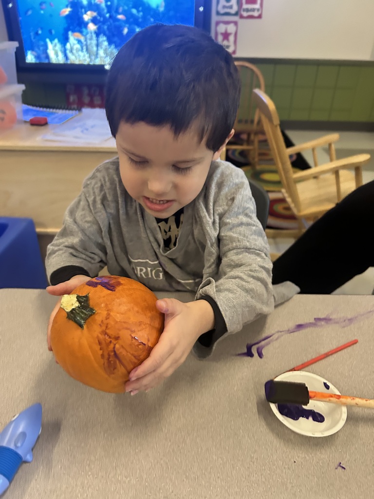 Mrs. Boiros' AM class painting pumpkins