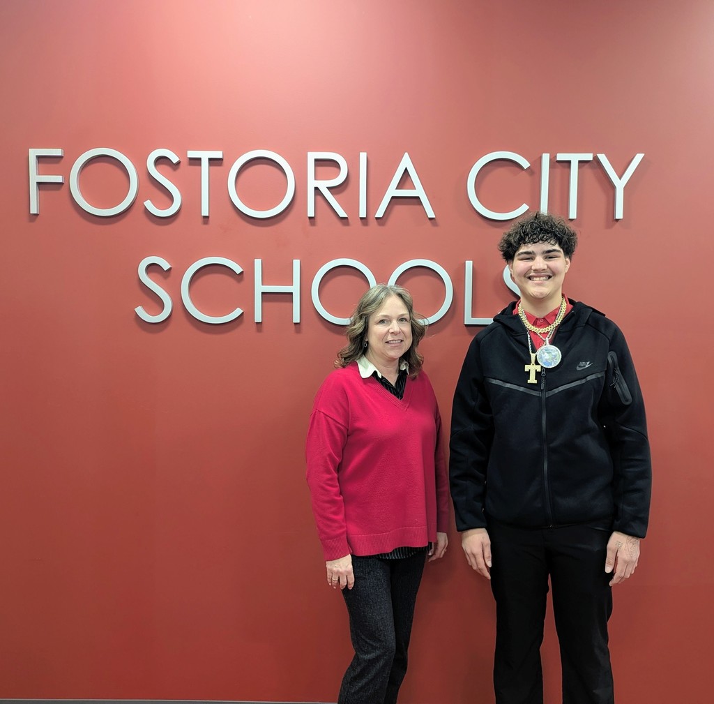 Student Trenton Keckler recognized by Fostoria Academy Director Erika Hossler