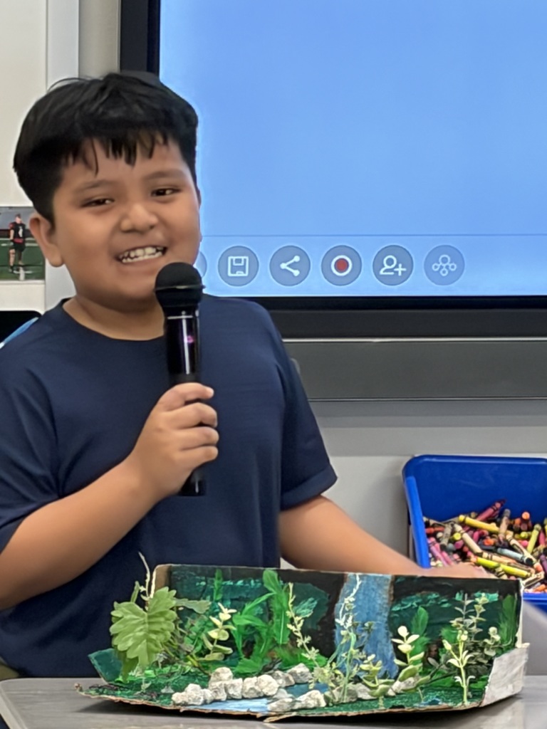4th grade student doing a habitat presentation
