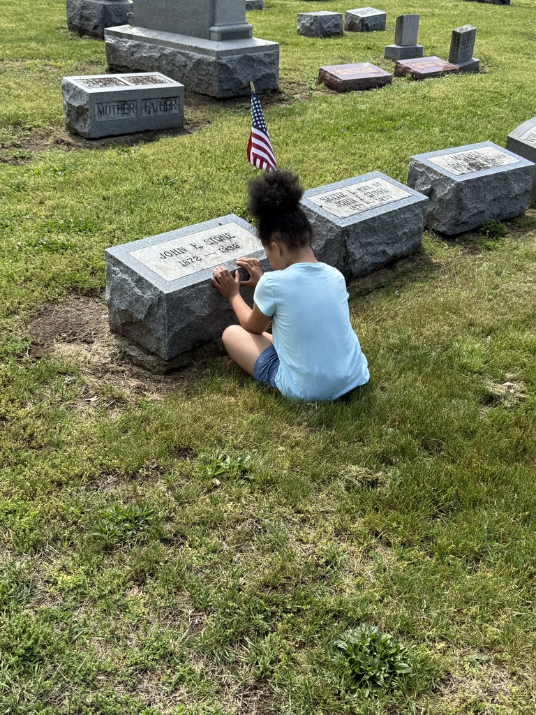 students saying "thank you" as they plant flags for Memorial Day