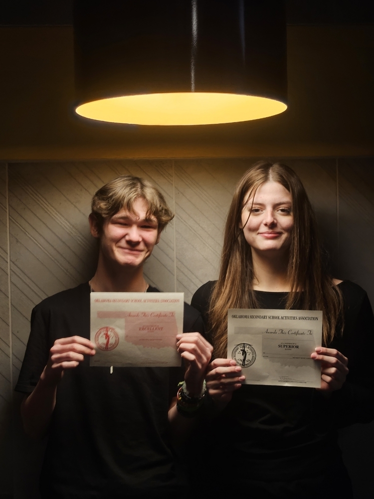 Band Students holding their awards