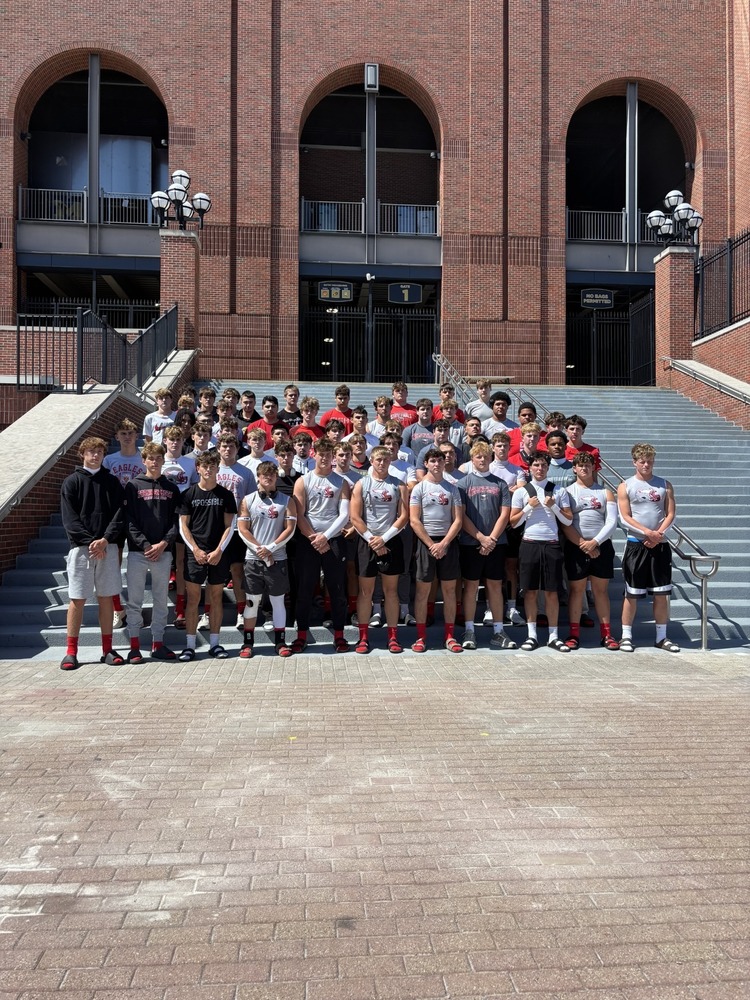 Frankenmuth Football Team stands for a picture outside of the Big House before the game