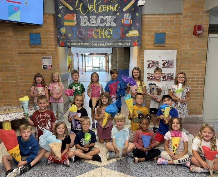 First Grade Students smiling for a photo