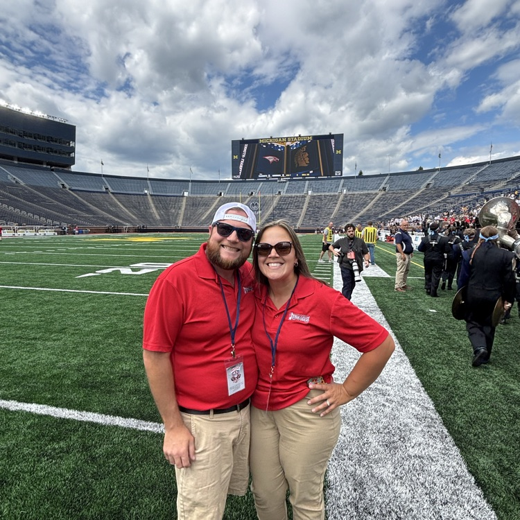 band directors take picture at the Big House