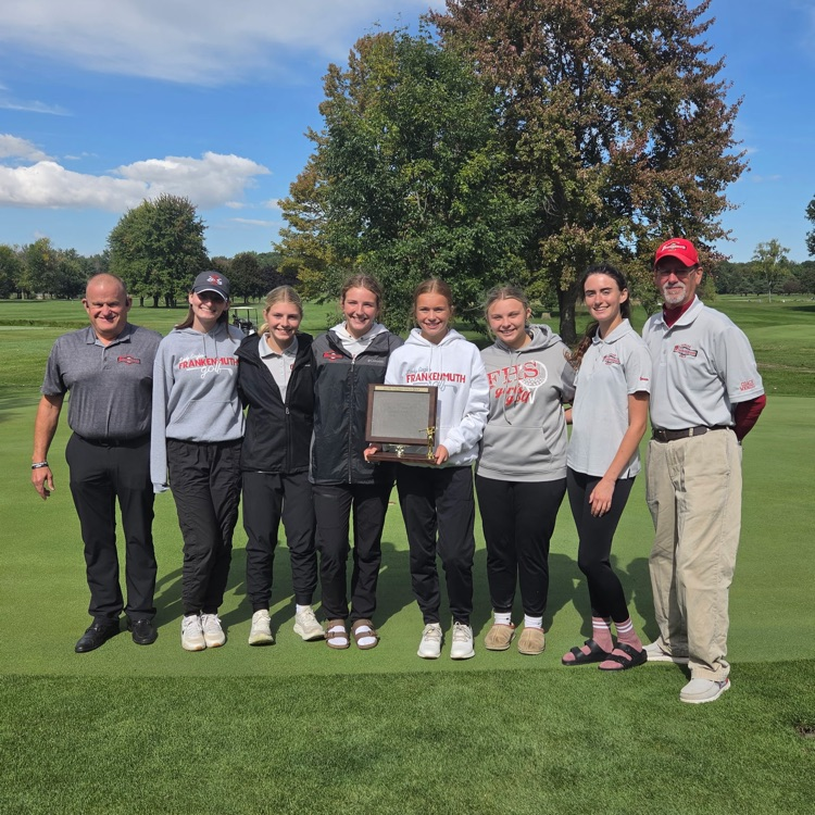 girls golf team poses for picture with trophy 
