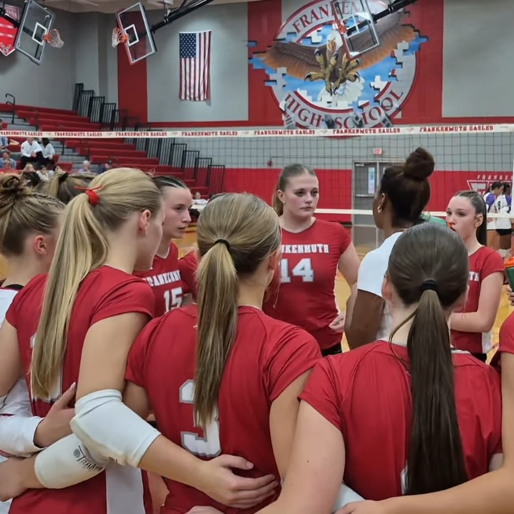 volleyball coach talks to team before game