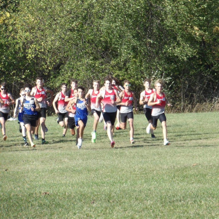 boys cross country runners begin race