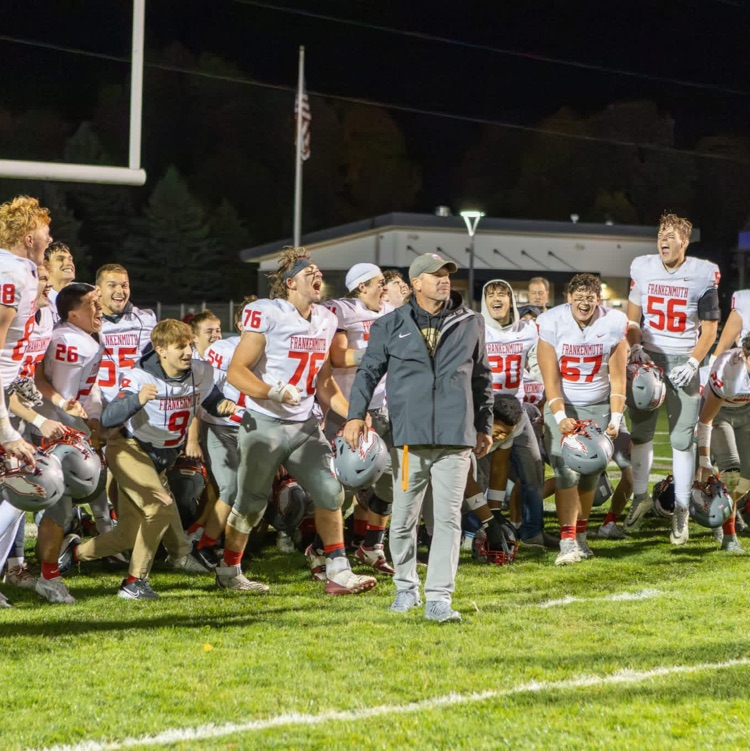 football team celebrates after win