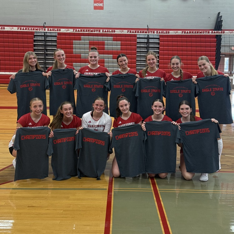 volleyball varsity poses for winning picture 