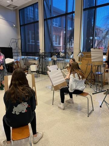 Students honing their painting skills