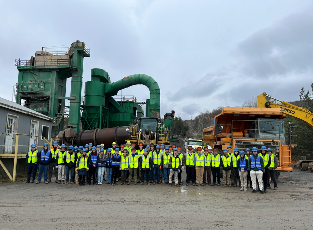 Seniors from AEC stand alongside upstone materials employees while on a visit to their worksite 