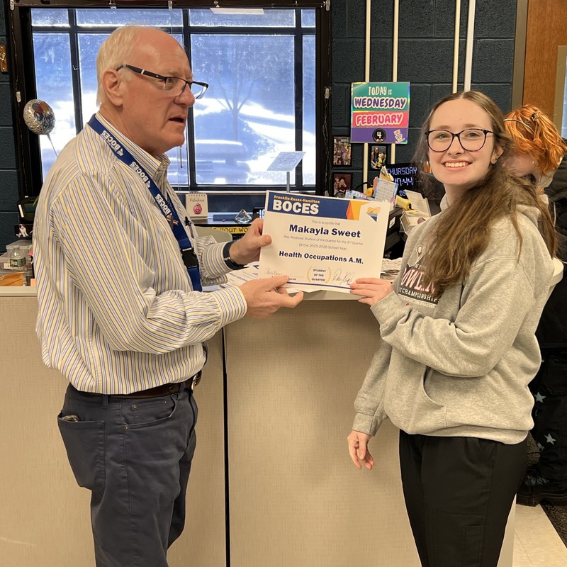 Makayla Sweet holds certificate