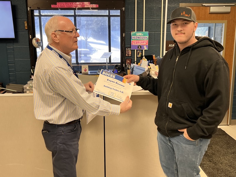 Evynn Reome accepts certificate