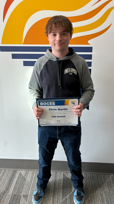 Martin holds certificate