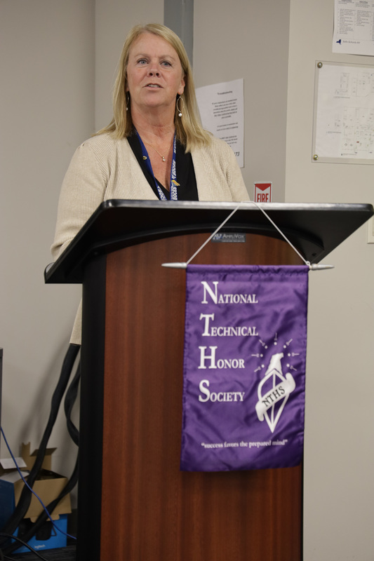 Deputy Superintendent Lori Tourville speaking at podium