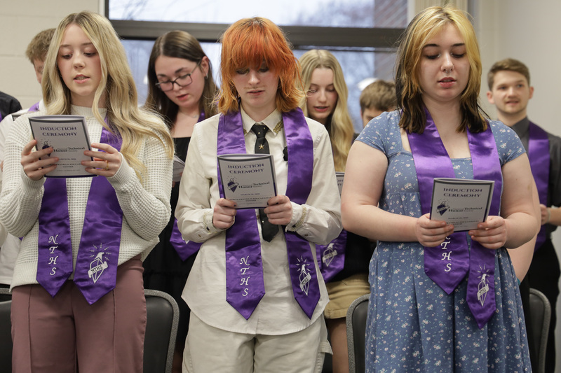 inductees reciting pledge