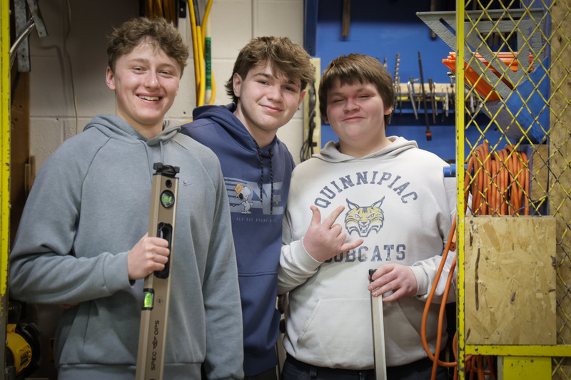 building trade students take photo together