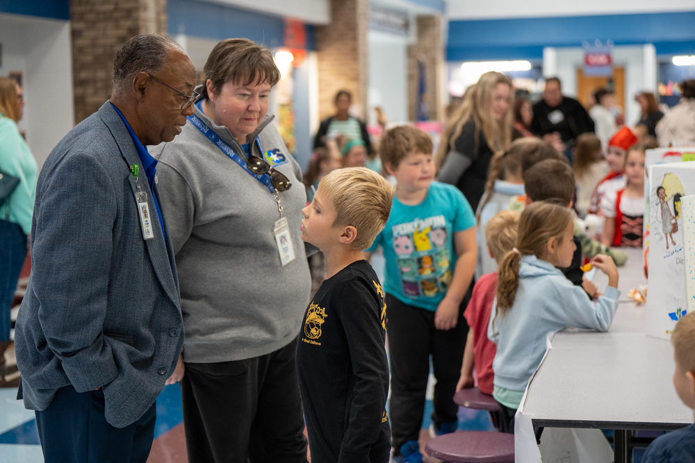Student  presents to board members at the event
