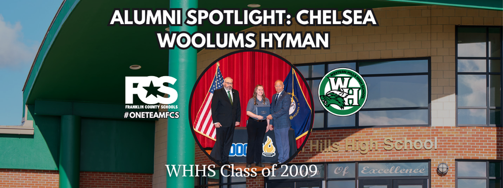 Promotional banner for Franklin County Schools' Alumni Spotlight featuring Chelsea Woolums Hyman. The top of the image reads: “ALUMNI SPOTLIGHT: CHELSEA WOOLUMS HYMAN.” In the center is a circular photo of three people standing in front of flags. To the left is the Franklin County Schools logo with the hashtag #ONETEAMFCS, and to the right is the Western Hills High School (WHHS) logo. The bottom text reads: “WHHS Class of 2009.” The background shows the exterior of Western Hills High School with its name visible on the building.