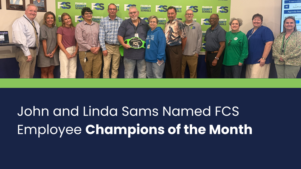 Landscape graphic with a photo on the top of the October Champions of the Month (John and Linda Sams) with the FCS Board of Education, student board members, assistant superintendents and the superintendent. On the bottom is white text on a navy blue background that says John and Linda Sams Named FCS Employee Champions of the Month.