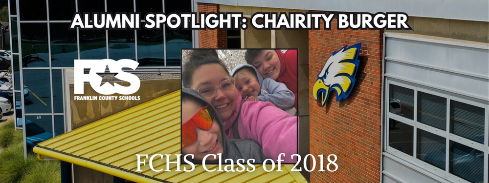 Promotional graphic for Franklin County Schools' Alumni Spotlight featuring Chairity Burger. The image shows a building with a yellow roof and large windows. On the left is the FCS (Franklin County Schools) logo, and on the right is an eagle mascot. In the center is a photo of two people with their faces blurred. Text reads: “ALUMNI SPOTLIGHT: CHAIRITY BURGER” at the top and “FCHS Class of 2018” at the bottom.