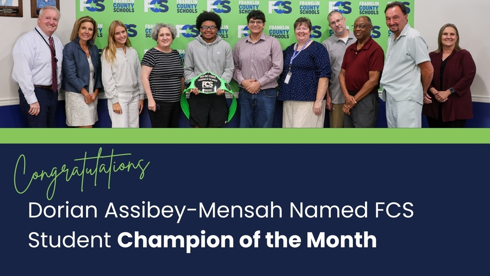 Graphic with a photo at the top of the September Student Champion of the Month with board members, student board members, superintendent, and assistant superintendents. The text below says: Congratulations. Dorian Assibey-Mensah Named FCS Student Champion of the Month