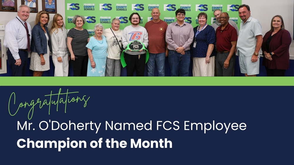 Graphic with a photo at the top of the September Champion of the Month with his family, board members, student board members, superintendent, and assistant superintendents. The text below says: Congratulations. Mr. O'Doherty Named FCS Employee Champion of the Month