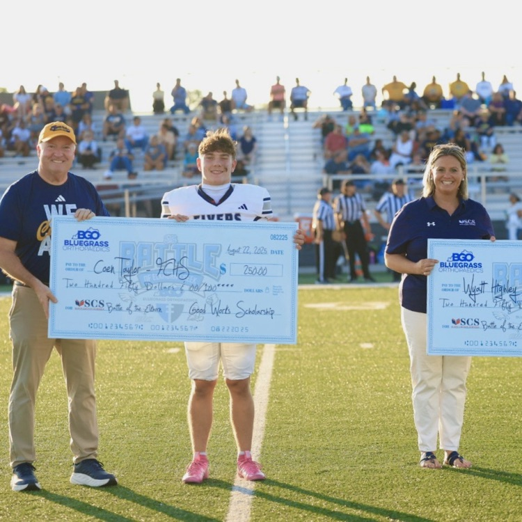 mark and Cole with check as well as members from GCHS