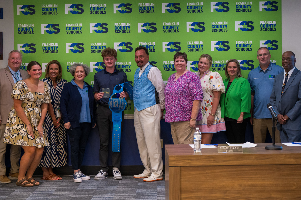 Henry with board members in Central Office