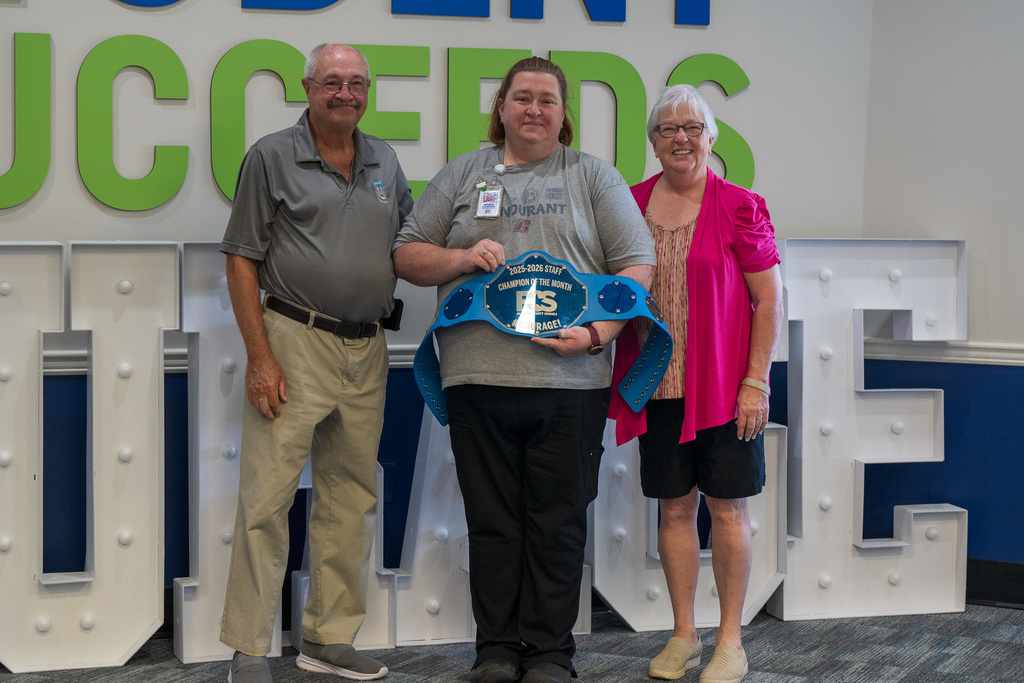 Jennifer Lafonatine with board members- Staff champion of hte month september 2025.