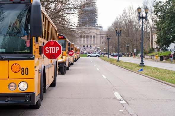 Buses parked in front of the capitol